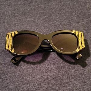 Stylish Black Sunglasses with Gold Accents